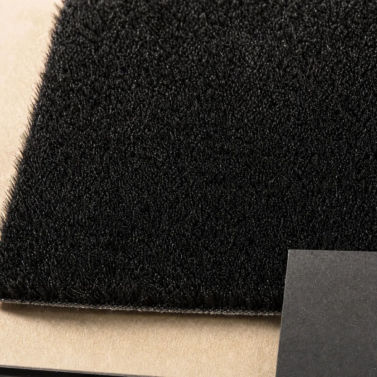 Short fine flock fibres shown as a dense surface sample