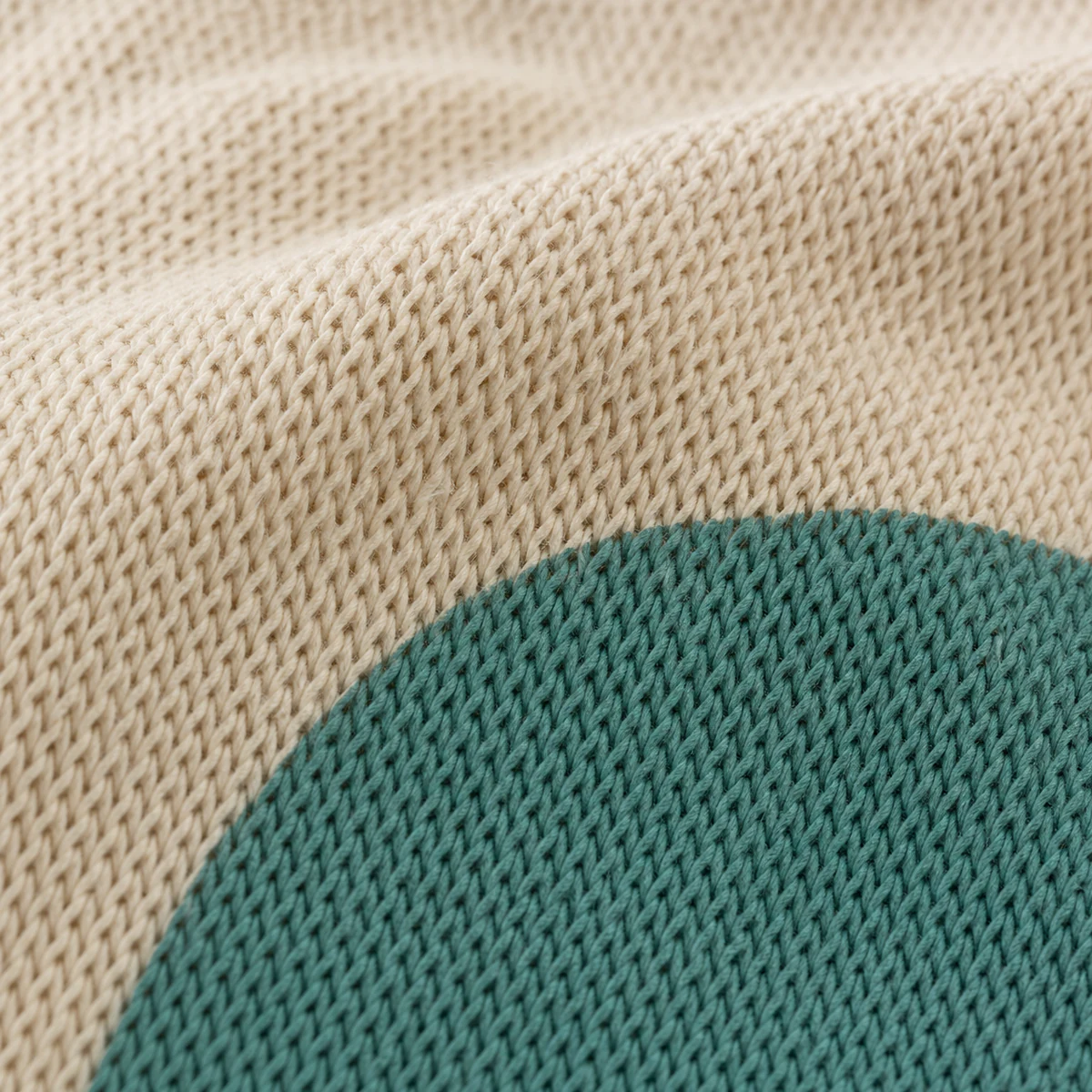 Close view of a water-based screen print on knitted fabric